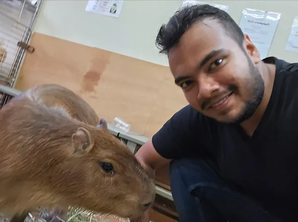 Posing with a capybara